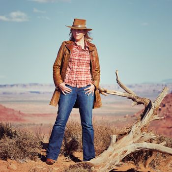 blond cowgirl in the desert, Utah, USA