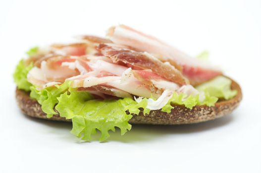 Sandwich with bacon and ham isolated on white background