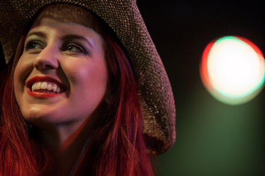 Attractive young woman dancing in a nightclub