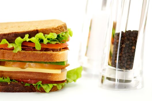 Classical BLT Club Sandwich with Saltcellar and pepperbox isolated on white background