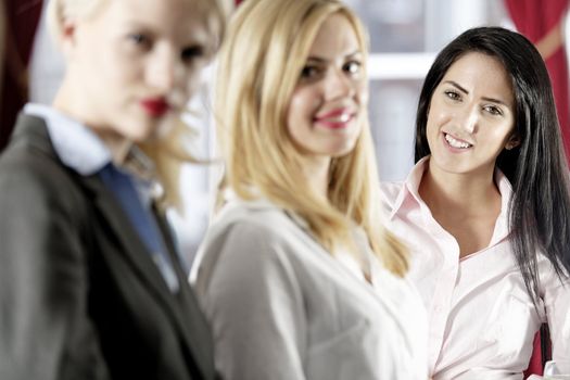 Three attractive female work colleagues together