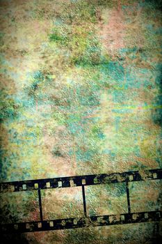 transparent negative film by old vertical grunge wall
