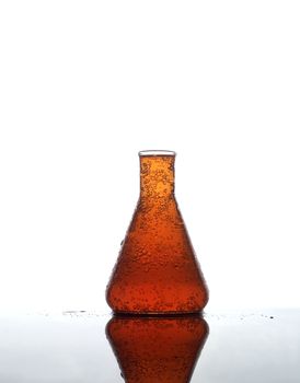 Laboratory Glass with orange liquid