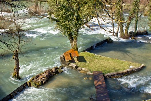 Resting place in pure nature on small river island in village Rastoke in Croatia