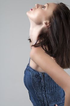 Female model wearing denim suit on isolated background