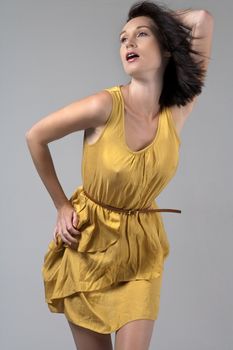 Woman wearing a flowing yellow dress