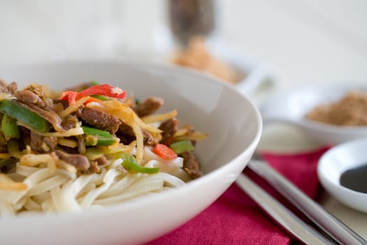 Delicious noodles with small pieces of beef and vegetables