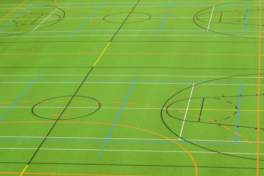 A photograph of a sports field, marked out for a variety of games. Suitable as background.