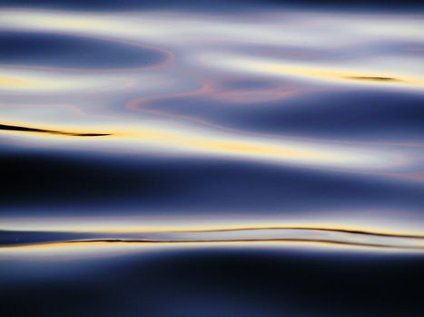 Colorful reflection in dark waves of pound
