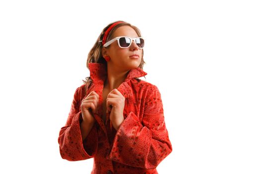 Modern looking young woman wearing a red jacket and sunglasses