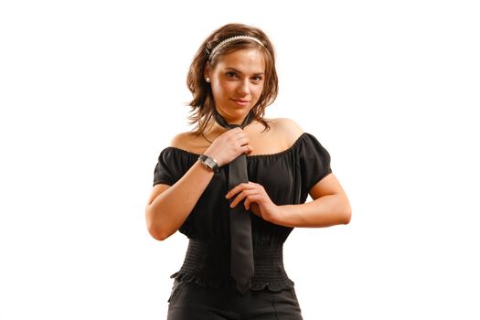 Modern looking young woman wearing a black dress and tie