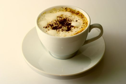 Ceramic mug with a cappuccino on a white background