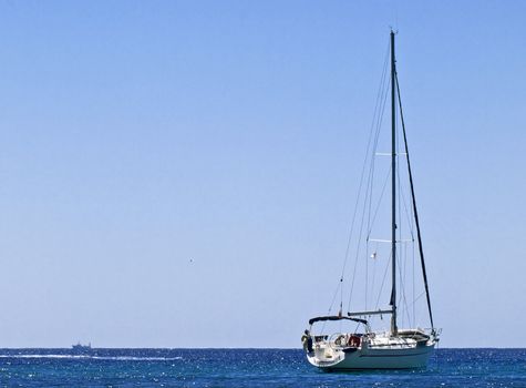 Yacht sailing across the deep blue azure waters of the Mediterranean Sea