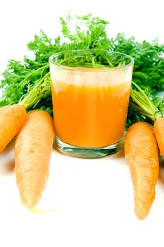 Fresh and ripe bunch of orange carrots with juice glass isolated on white background
