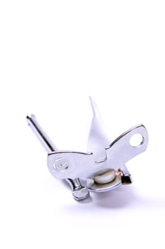 Hand operated can opener, isolated against white background