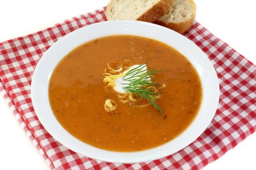 a bowl of lobster soup with dill and lemon