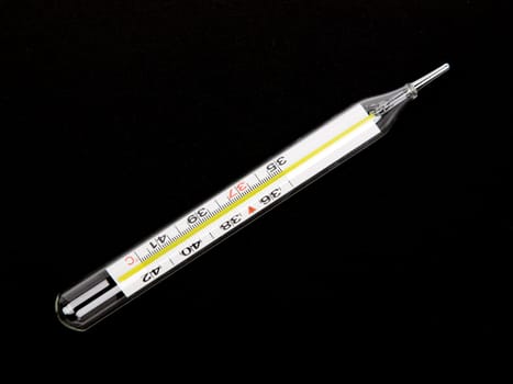 medical thermometer isolated on the black bacground