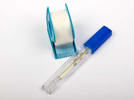 white bandage and the thermometer in plastic box