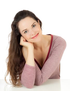 Isolated portrait of an attractive young female sitting down relaxing.
