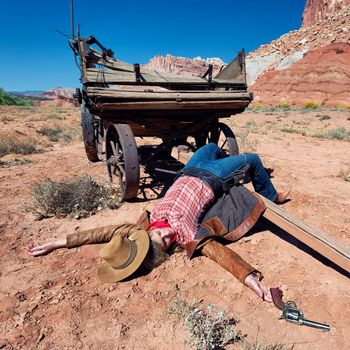 dead cowgirl lying on the floor, western spirit