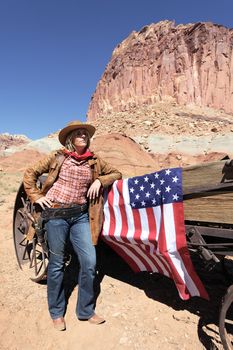 portrait of a blond young woman with american flag