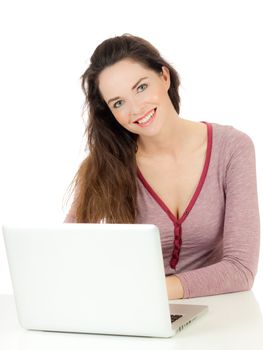 Closeup of a young cute woman using a laptop computer