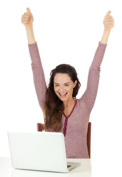Isolated portrait of a very happy beautiful woman looking at laptop and doing thumbs up