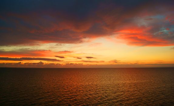 View on sunlit clouds in setting sun