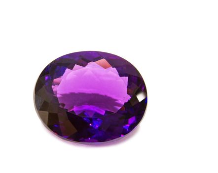 Single violet amethyst gem on white background