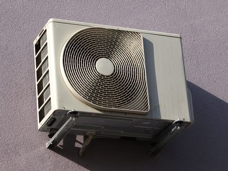 outdoor unir of airconditioner  hooked on the building    