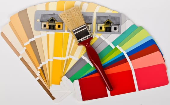 paint brush with colored houses on the swatch