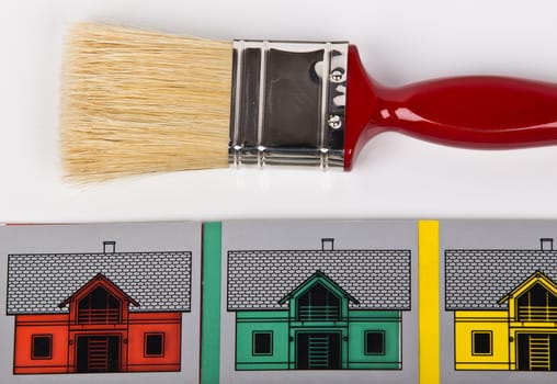 paaint brush and houses in few colors