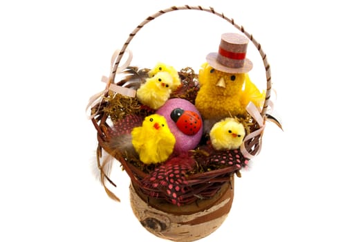 Easter composition in wicker basket on a white background