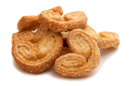 stack with heart-shaped biscuits on white background