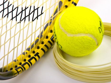 tennis racket string and yellow ball
