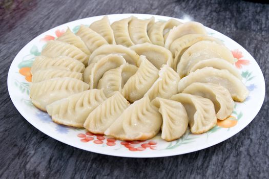 Plate of Potstickers Chinese Pork Dumplings Asian Appetizer Dish