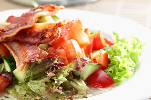 Fresh and tasty salad on the wooden table