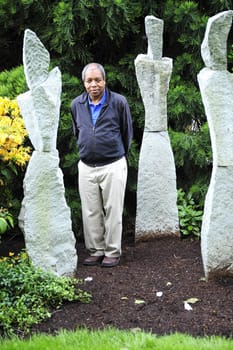 African American male posing outside.