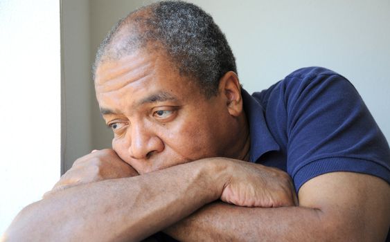 African American male expressions indoors.