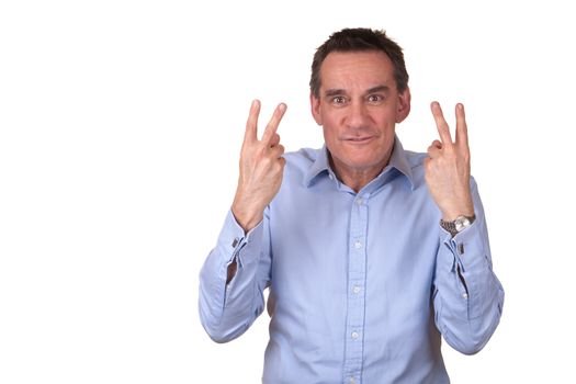 Attractive Frustrated Angry Middle Man in Blue Shirt Giving Two Finger Sign Isolated