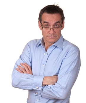 Suprised Irritated Middle Age Man in Blue Shirt with Arms Folded and Glasses Isolated