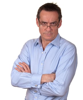 Angry Frowning Middle Age Man in Blue Shirt with Arms Folded wearing Glasses Isolated