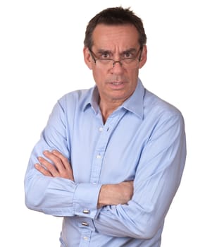 Attractive Frowning Surprised Middle Age Man in Blue Shirt with Arms Folded Isolated