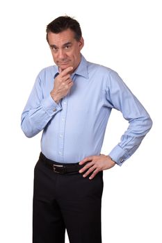 Attractive Middle Age Man in Blue Shirt with Thoughtful Expression and Hand on Hip
