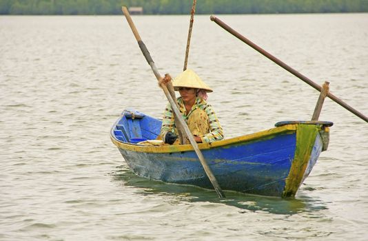 Local woman in a boat, Ream National Park, Cambodia, Southeast Asia