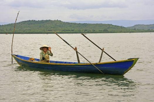 Local woman in a boat, Ream National Park, Cambodia, Southeast Asia