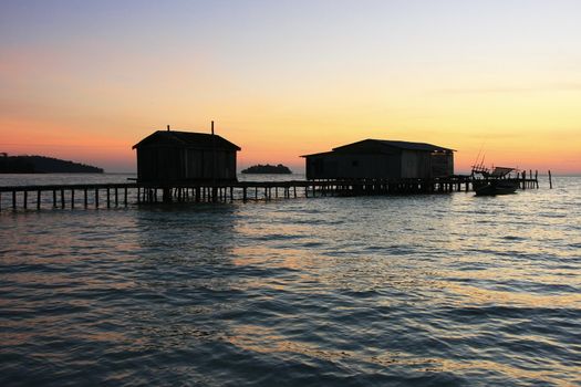 Silhouette of wooden jetty at sunrise, Koh Rong island, Cambodia, Southeast Asia