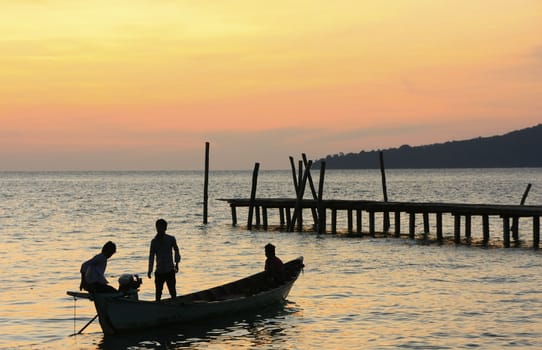 Silhouette of traditional fishing boat at sunrise, Koh Rong island, Cambodia, Southeast Asia