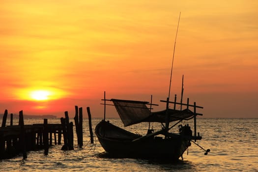 Silhouette of traditional fishing boat at sunrise, Koh Rong island, Cambodia, Southeast Asia