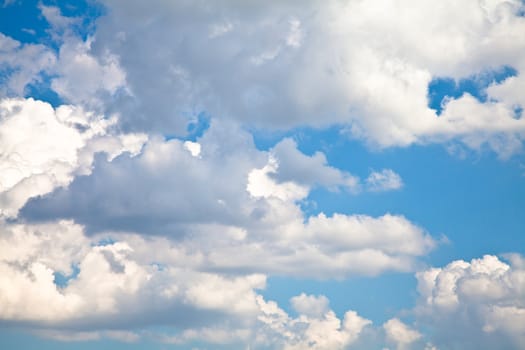 Blue summer sky with white clouds with copy space